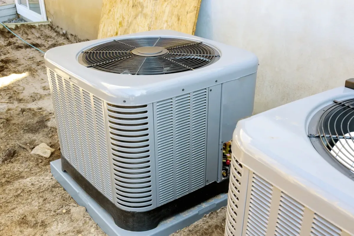 Two outdoor air conditioner condensers
